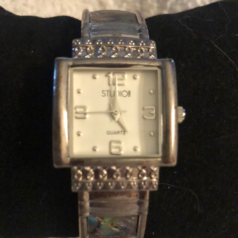 Studio Brand silver toned faux abalone bracelet watch.